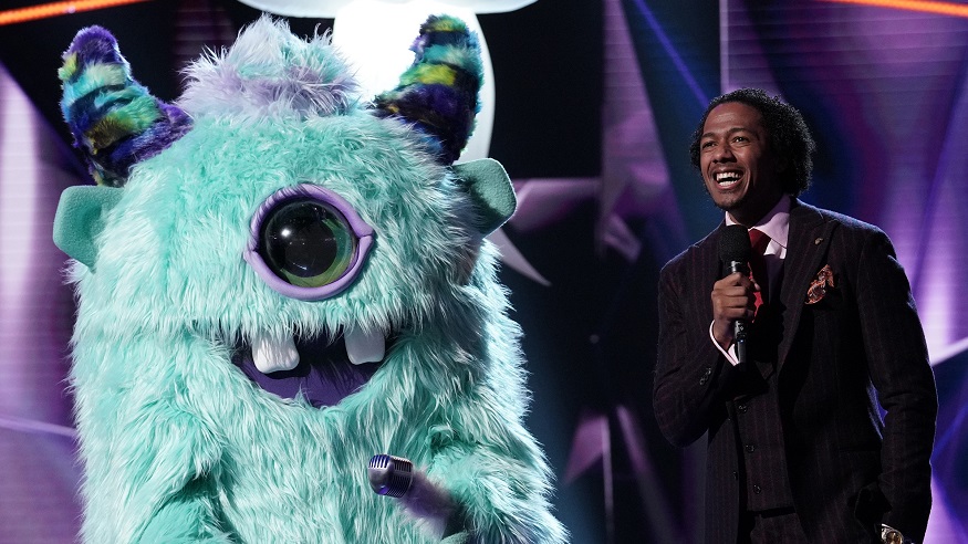 The Masked Singer host Nick Cannon poses with Monster